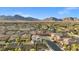 A beautiful neighborhood featuring well-maintained homes with diverse architectural styles, nestled amidst lush greenery and scenic mountains at 12219 Crystal Shore Ave, Las Vegas, NV 89138