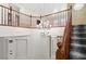 An elegant foyer with a decorative chandelier, and wooden railing staircase leading to the second level at 12219 Crystal Shore Ave, Las Vegas, NV 89138