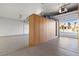 Spacious garage with epoxy flooring and built-in storage cabinets, perfect for organization at 12219 Crystal Shore Ave, Las Vegas, NV 89138
