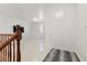 Bright hallway with tile floors, staircase, and decorative round window at 12219 Crystal Shore Ave, Las Vegas, NV 89138