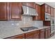 Gourmet kitchen features stainless steel appliances and granite countertops at 12219 Crystal Shore Ave, Las Vegas, NV 89138