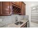Kitchen sink with granite countertop, wine rack, and pantry at 12219 Crystal Shore Ave, Las Vegas, NV 89138