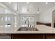 Kitchen island features granite countertops and dual sink with pendant lighting at 12219 Crystal Shore Ave, Las Vegas, NV 89138