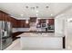 Open kitchen with stainless steel appliances and granite countertops at 12219 Crystal Shore Ave, Las Vegas, NV 89138
