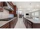 Open kitchen with stainless appliances, granite counters, and gas cooktop at 12219 Crystal Shore Ave, Las Vegas, NV 89138