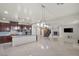 Bright and airy living room featuring tile flooring, a fireplace, and an open concept design at 12219 Crystal Shore Ave, Las Vegas, NV 89138