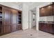 Office featuring custom built-ins, granite countertops, and easy access to laundry at 12219 Crystal Shore Ave, Las Vegas, NV 89138