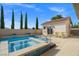 Backyard pool features a spa, cabana, and desert landscaping at 12219 Crystal Shore Ave, Las Vegas, NV 89138