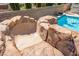 Fantastic view of the pool with a rock slide, waterfall, and beautiful turquoise water at 12219 Crystal Shore Ave, Las Vegas, NV 89138