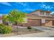 Home featuring two-car garage, tiled roof and front landscaping at 1435 Orange Jubilee Rd, Henderson, NV 89014
