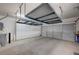 Spacious garage features overhead storage rack, built-in cabinets and room for two cars at 1435 Orange Jubilee Rd, Henderson, NV 89014