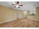 A spacious living room and dining area featuring hardwood floor, recessed lighting, and breakfast bar to the kitchen at 1435 Orange Jubilee Rd, Henderson, NV 89014