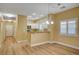 Inviting living space with wood-look flooring, recessed lighting, and a view into the kitchen at 1435 Orange Jubilee Rd, Henderson, NV 89014