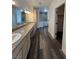Bathroom featuring dual sinks, vanity and wood-look flooring at 1830 Justine Ct, Pahrump, NV 89048