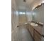 Bathroom with tile floor, vanity and bathtub with shower at 1830 Justine Ct, Pahrump, NV 89048