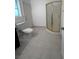 Bathroom features a toilet and a glass enclosed shower at 1830 Justine Ct, Pahrump, NV 89048