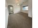 Bedroom with neutral carpeting, and a large window providing natural light at 1830 Justine Ct, Pahrump, NV 89048