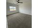 Bedroom featuring a window with a view and soft neutral carpet at 1830 Justine Ct, Pahrump, NV 89048