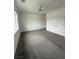 Bedroom with carpeted floors, ceiling fan, window and doors at 1830 Justine Ct, Pahrump, NV 89048