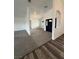 Inviting entryway featuring carpeted floors and a striking black front door at 1830 Justine Ct, Pahrump, NV 89048