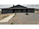 Rear exterior of home with large backyard at 1830 Justine Ct, Pahrump, NV 89048