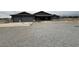 Charming single-story home with gravel front yard and attached two-car garage at 1830 Justine Ct, Pahrump, NV 89048
