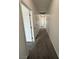 Neutral hallway featuring multiple doors and overhead lighting at 1830 Justine Ct, Pahrump, NV 89048
