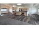 Open-concept kitchen featuring an island, stainless steel appliances, and wood cabinets at 1830 Justine Ct, Pahrump, NV 89048