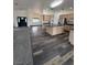 Spacious kitchen with stainless steel appliances, wooden cabinets, and dark wood-look flooring at 1830 Justine Ct, Pahrump, NV 89048