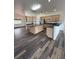Modern kitchen featuring an island, stainless steel appliances, and hardwood floors at 1830 Justine Ct, Pahrump, NV 89048
