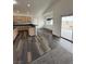 Modern kitchen featuring an island, stainless steel appliances, and hardwood floors at 1830 Justine Ct, Pahrump, NV 89048