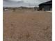 Wide shot of the expansive, flat land lot with a partial view of the home at 1830 Justine Ct, Pahrump, NV 89048