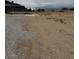 Image of the land with a partial view of the house and surrounding houses in the distance at 1830 Justine Ct, Pahrump, NV 89048