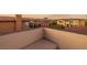 This balcony view features desert landscaping and gorgeous mountain views at sunset at 19 Rue Grimaldi Way, Henderson, NV 89011