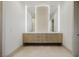 Bright bathroom features double sinks, stylish wood cabinets, and modern lighting for a spa-like feel at 19 Rue Grimaldi Way, Henderson, NV 89011