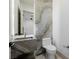 A modern bathroom features unique stone sink and vanity at 19 Rue Grimaldi Way, Henderson, NV 89011