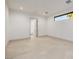A spacious bedroom with tile flooring and access to bathroom at 19 Rue Grimaldi Way, Henderson, NV 89011