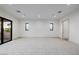 Expansive bonus room with neutral carpeting, recessed lighting, and access to an outdoor balcony at 19 Rue Grimaldi Way, Henderson, NV 89011