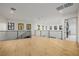 Bright bonus room showcasing hardwood floors, black metal railings, and an abundance of natural light at 19 Rue Grimaldi Way, Henderson, NV 89011