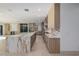 Modern kitchen featuring marble countertops, an island, and sleek cabinetry at 19 Rue Grimaldi Way, Henderson, NV 89011