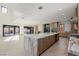 Bright kitchen with a marble island, stainless steel appliances, and an open floor plan at 19 Rue Grimaldi Way, Henderson, NV 89011