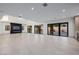 Bright living room with fireplace, bar area, and expansive sliding glass doors at 19 Rue Grimaldi Way, Henderson, NV 89011