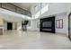 Expansive living area showcasing high ceilings, a modern fireplace, and open access to other living spaces at 19 Rue Grimaldi Way, Henderson, NV 89011