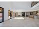 Bright open-concept living area boasts sleek kitchen, bar area, and outside access at 19 Rue Grimaldi Way, Henderson, NV 89011