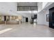 Spacious living room showcases an open floor plan, modern fireplace and staircase at 19 Rue Grimaldi Way, Henderson, NV 89011