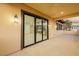 View into a living room from a covered patio featuring large glass doors at 19 Rue Grimaldi Way, Henderson, NV 89011