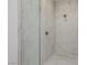 The spa-like shower features marble walls, sleek hardware, and modern fixtures at 19 Rue Grimaldi Way, Henderson, NV 89011