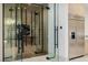 A wine cellar room with glass door and view of the staircase at 19 Rue Grimaldi Way, Henderson, NV 89011