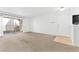 Spacious living room featuring balcony access and adjacent entry, enhancing natural light and space at 1900 Mountain Hills Ct # 203, Las Vegas, NV 89128