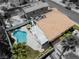 Home's backyard showcasing the beautiful pool, outdoor kitchen, covered patio, and lush landscaping, creating a private oasis at 222 Hollyfern St, Henderson, NV 89074